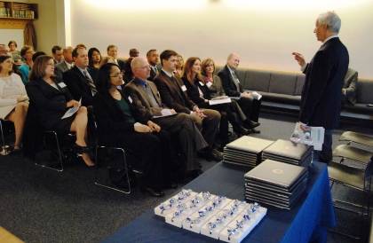 President Richard H. Brodhead, right, addresses the fourth Duke Leadership Academy class at their graduation ceremony Dec. 13. Photo by Marsha A. Green