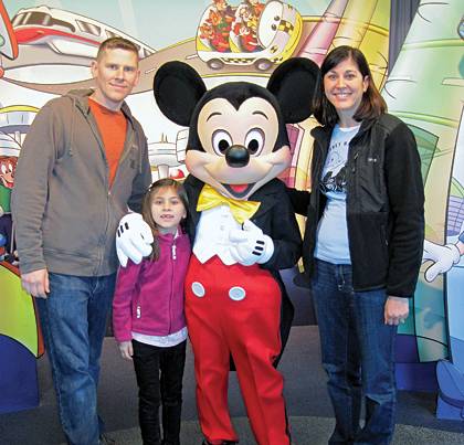 Erin Bartels, right, enjoys a trip to Disney World with her husband, Matt, and daughter, Ada. Photo courtesy of Erin Bartels.