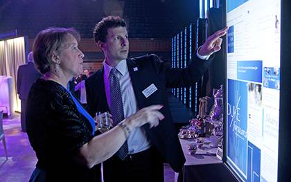 William Conescu, right, former director of Duke development communications, explores the Duke Forward website with Alice McKenzie at the Duke Forward campus launch. Photo by Duke Photography.