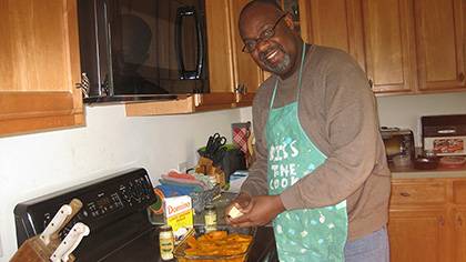 Kerry Haynie loves to cook and bake traditional family dishes like cream cheese pound cake and German chocolate cake, a few favorite desserts. Here, he’s making a sweet potato casserole. Courtesy of Kerry Haynie 