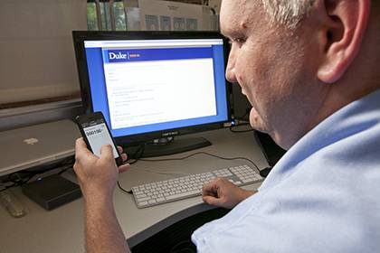 John Owens, an analyst with Duke's Office of Information Technology (OIT), is one of about 200 Duke employees piloting a new two-step verification system.