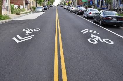 Many Duke roads feature sharrows - symbols that alert drivers to share the road with bicyclists. Photo by Eric Gililland via Flickr.