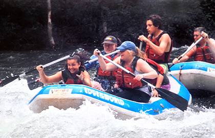 Zarrin Brooks, center with blue hat, rides rapids with her daughter, Timia, during a recent weekend getaway. Brooks tries to take short, monthly vacations with Timia and her other daughter, Rhianna. Photo courtesy of Zarrin Brooks.
