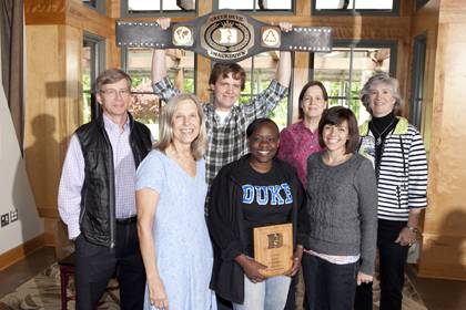 Members of the 'Green Monkeys' celebrate their Green Devil Smackdown victory with the sustainability program's championship belt. Photo by Duke Photography.