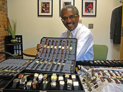 Benjamin D. Reese, Jr. Duke's vice president for Institutional Equity, with some of the more than 100 wristwatches he has collected. Photo by Marsha A. Green.