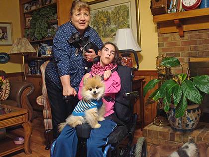 Ellen Robinson and her daughter, Ashley, foster dogs such as Bidawee, a black Chihuahua, and Beanie, a Pomeranian. Photo courtesy of Ellen Robinson.