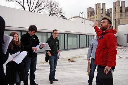 Casey Collins, energy engineer with Duke Facilities Management, leads a class of graduate students while discussing energy planning and use on campus. He and Steve Palumbo, also with Facilities, are co-teaching the class this semester. Photo by Bryan Rot