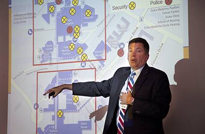 John Dailey, chief of Duke Police, explains aspects of his department during a past
