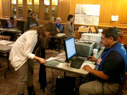 Graduate student Tessa Gurney gets her ballot Wednesday at the early voting site in Duke's West Union Building.  Photo by Steve Hartsoe.