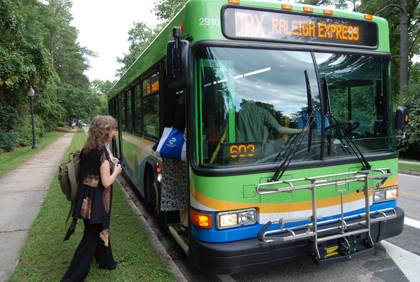 Orla Swift, left, boards Triangle Transit's Durham-Raleigh Express bus. Swift is among about 5,000 Duke community members who use a free GoPass to ride area buses.