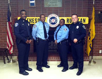 Duke Police Capt. Michael Linton, left, poses with officers Randall Jackson, Deonte Kennedy and Kelly George. All three participated in training as part of Duke’s Crisis Intervention Team, a program that provides local first responders with training in