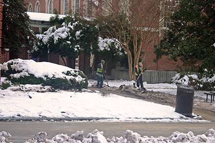 Facilities Management staff clear sidewalks on East Campus after last week's snowfall. In all, crews from the university and health system racked up almost 3,000 work hours to keep campus safe. Photo courtesy of Facilities Management.