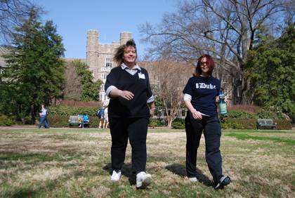 Debbie Edenton, left, and LaDonna Lindstedt, right, go for a walk on Duke's West Campus Quad. The pair is using the Get Moving Challenge as a way to prepare for kidney transplant surgery. Photo by Bryan Roth.