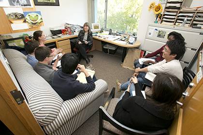 Sally Kornbluth, Duke's eleventh provost, meets with members of her lab team in the Levine Science Research Center. Photo by Duke Photography