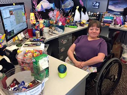 Lenore Ramm, an IT analyst with the Office of Information Technology, shows personality at her desk with a variety of plush animals, a lava lamp, wall hangings and more. Photo courtesy of Duke OIT.