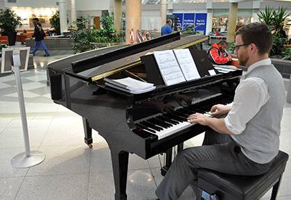William Dawson, an artist in residence for Arts & Health at Duke, plays piano in the Duke Hospital lobby on Thursdays. Photo by April Dudash