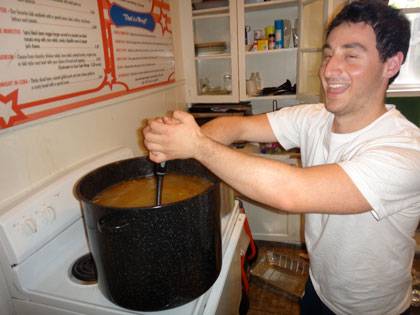 Jeremy Moskowitz stirs the pot before the AEPi Passover seder.