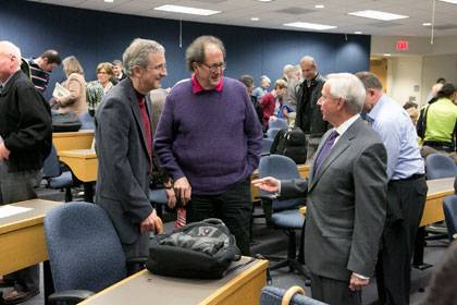 President Brodhead greets Steve Nowicki and Walter Sinnott-Armstrong before his annual address to the faculty Thursday. Photo: Les Todd/Duke University Photography