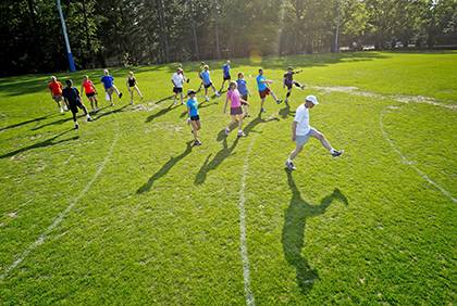 Employees get moving during a Duke Run/Walk Club gathering in the spring.