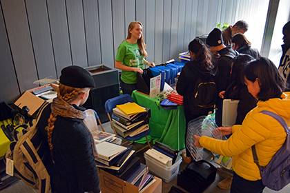 Student Madison Barnes oversees the Duke Free Store as Duke community members sort through a variety of items being given away for free. The next tabling event will take place Feb. 26. Photo by Bryan Roth.