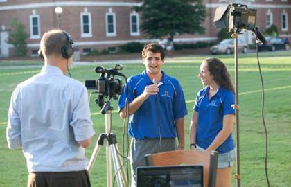 James Todd of Duke's Office of News and Communications films students Jonathan Salzman and Ashley Alman during a live webcast of the Class of 2015 photo shoot. Photo by Megan Morr