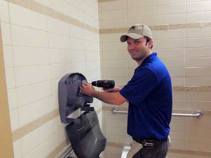 Crews are installing new toilet and paper towel dispensers in academic buildings across campus. Photo courtesy of Albert Scott.