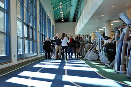 Kara Mitchell, an exercise physiologist with the Duke Health and Fitness Center, leads a tour group around the new facility on Friday. Photo by April Dudash