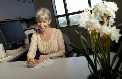 Valerie Duke uses a food journal to help her maintain the weight loss she achieved through LIVE FOR LIFE coaching programs. Photo by Duke Photography.