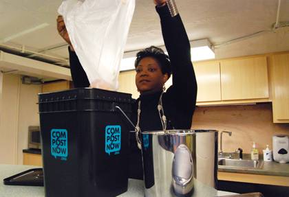 Lisa Moore, accounting specialist with Chapel Services, empties a bag of compostable material into a composting bucket. The bucket is shared among Duke community members who use a shared kitchen at the Chapel. Photo by Bryan Roth.