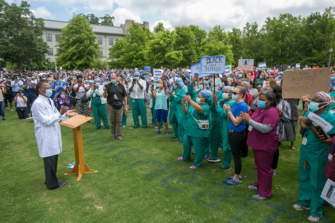 Dr. Eugene Washington speaks to the participants following the solidarity march.