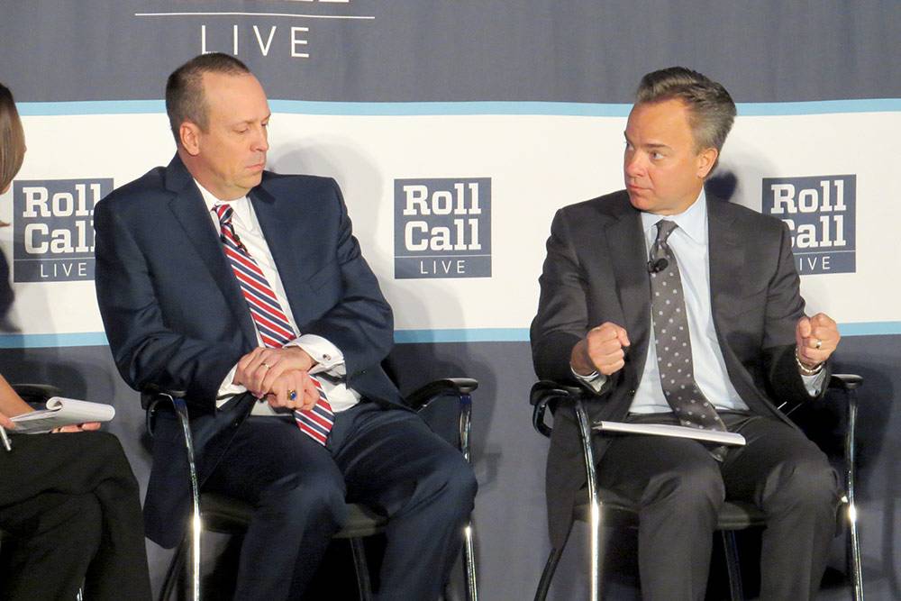 Mark McClellan, right, discusses what's next in health care policy Wednesday at a Roll Call forum. US Senate staff member Rodney Whitlock also participated on the panel. Photo by Jeff Harris