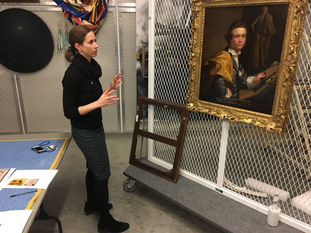 Molly Boarati in the Nasher Museum basement with the painting