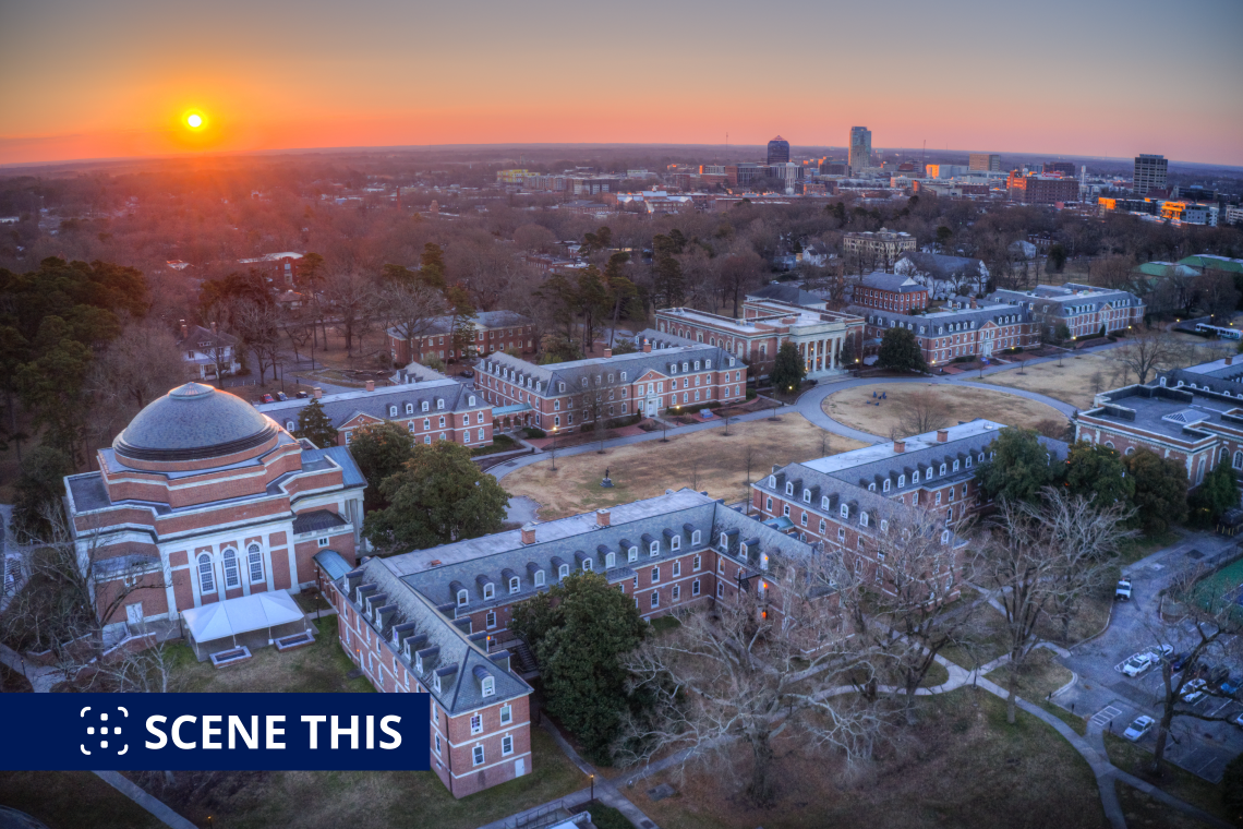 sunrise over East. Campus, with downtown Durham in the background