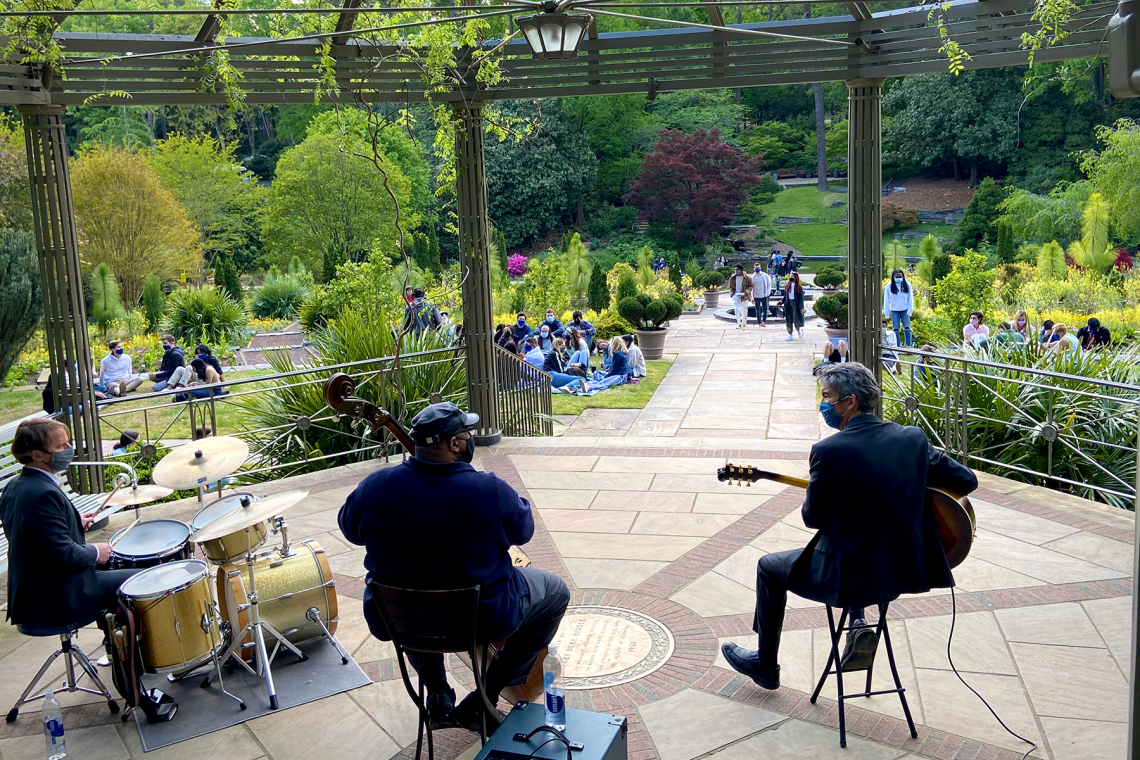 Seniors gather by the Cindy Brodhead Pergola in Duke Gardens to hear jazz music Thursday afternoon. Photo by Jared Lazarus