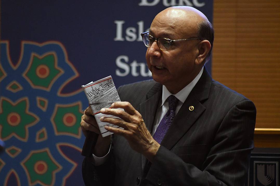 Khizr Khan reads from the constitution during his talk Thursday at Duke. Photo by Bryan Roth/Kenan Institute for Ethics