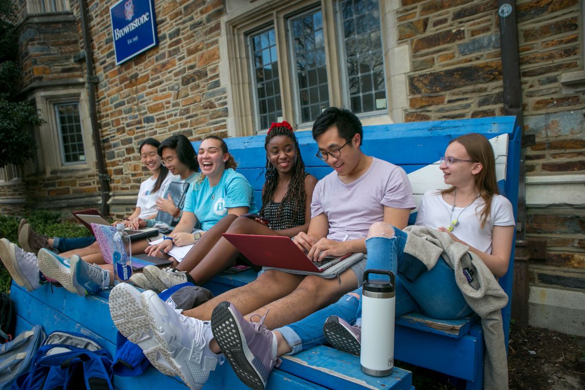 Brownstone dorm roommates, from left, Katherine Li, junior, Martin Trinh, sophomore, Katlyn Hurst, sophomore, Allayne Thomas, sophomore, Charlie Liang, senior, and Jen Semler, senior, enjoy an unusually warm February afternoon to study and socialize outsi