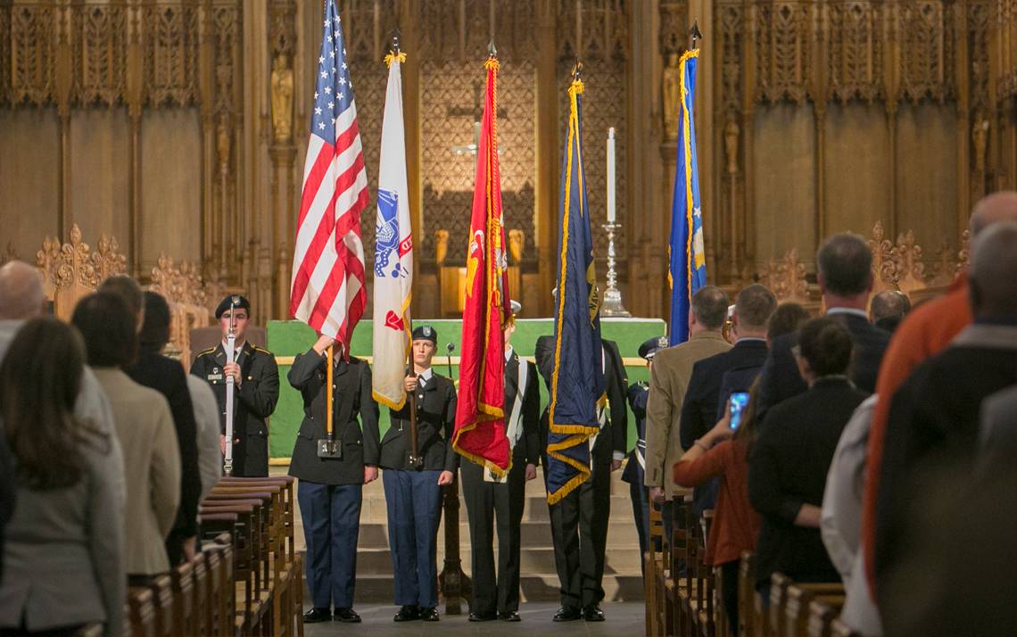 Members of Duke's ROTC programs hold flags aloft Monday as Duke's annual Veterans Day commemoration began. Photo by Jared Lazarus.