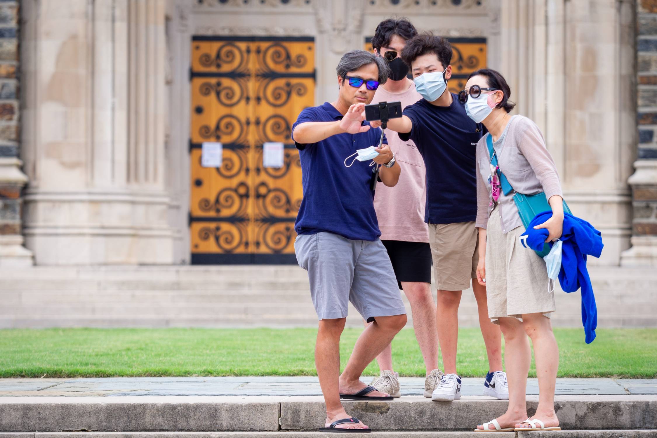 Incoming freshman and their families take selfies on Chapel quad on the first day of move-in for the class of 2024 