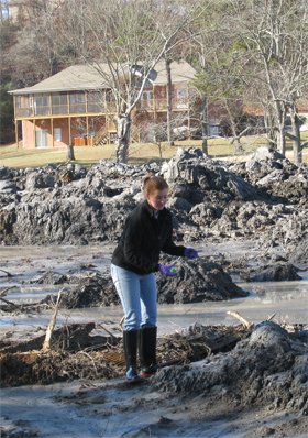 Duke graduate student Laura Ruhl collects samples from a site affected by the TVA coal sludge spill. 