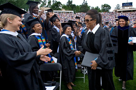 Commencement speaker Oprah Winfrey greets Duke students at Sunday's ceremony. 