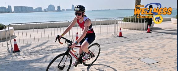 Brianna Blackwell bikes around Das Island.