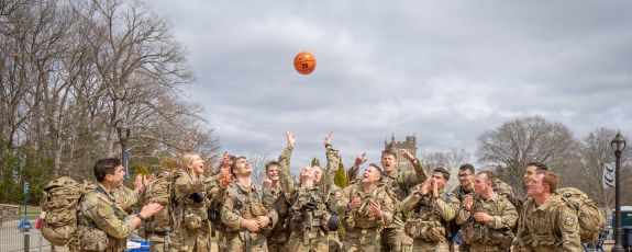 ROTC members from Duke and UNC toss the game ball up on Duke’s campus