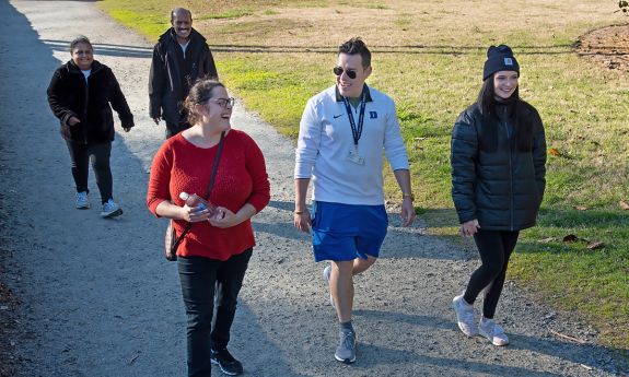 Spring 2023 Duke Run/Walk Club participants walk around the East Campus loop. Photo by Les Todd.