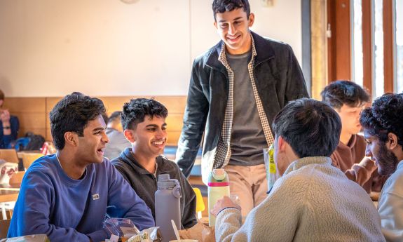 students greet each other on the first day of classes for the spring semester.
