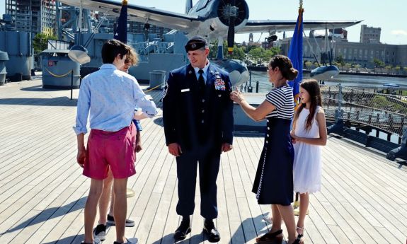 Stoltenberg family at a military promotion ceremony. The kids are “pinning on” his new rank.