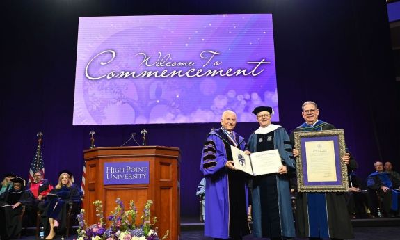 High Point President Nido Qubein presented an honorary Doctor of Humane Letters degree to Dr. Vincent Price, president of Duke University and the Graduate Commencement speaker. They were joined by HPU Provost Daniel Erb.