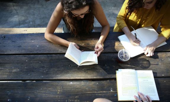 students reading outside at a rural high school