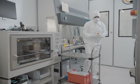 A Duke Human Vaccine Institute researcher working in one of the new vaccine manufacturing labs