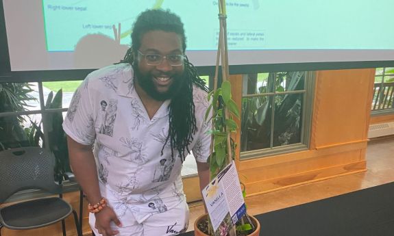 Derek Haynes with a vanilla plant