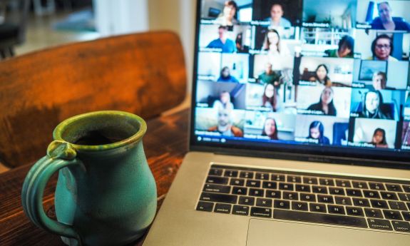 A coffee mug and a laptop.